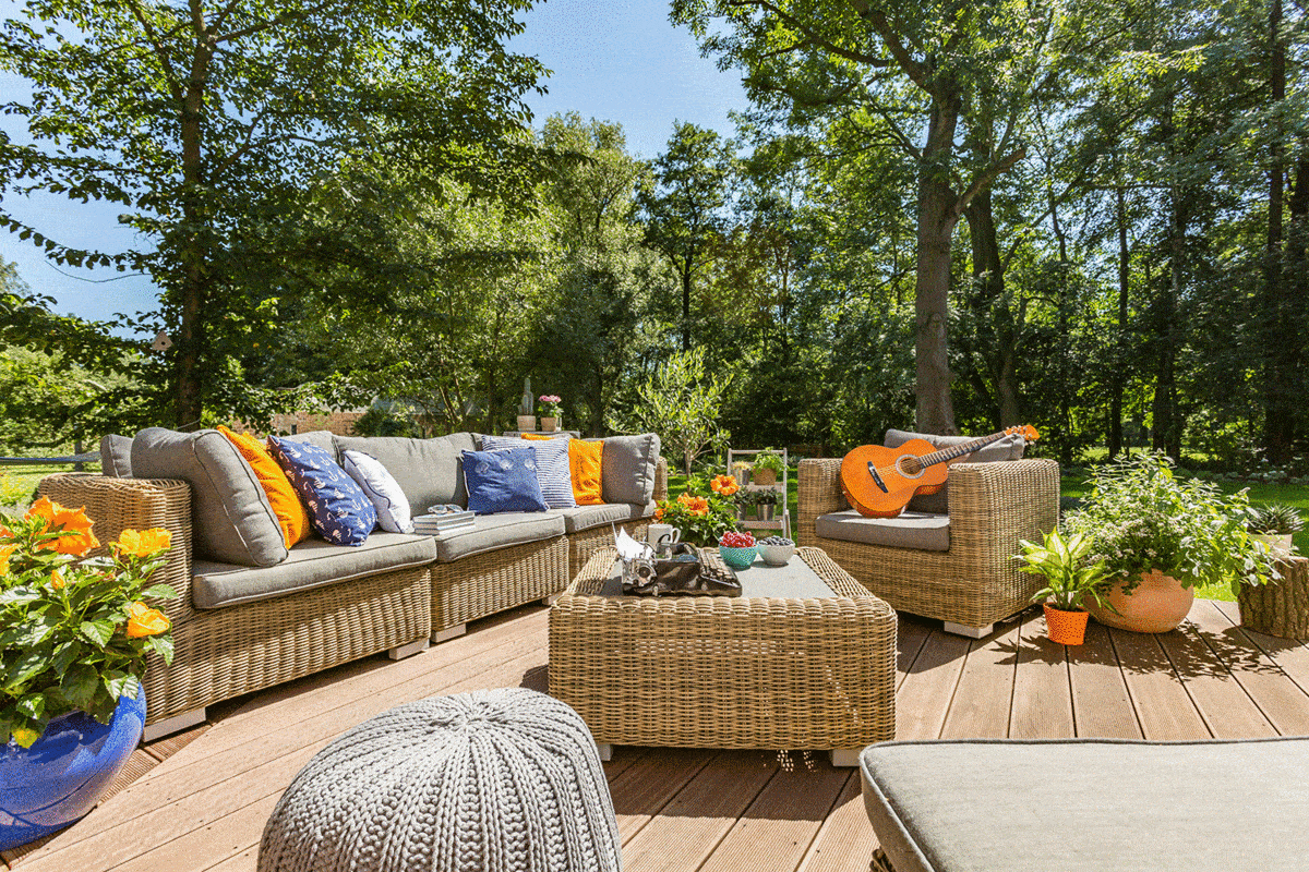Spacious villa patio with comfortable stylish rattan furniture set