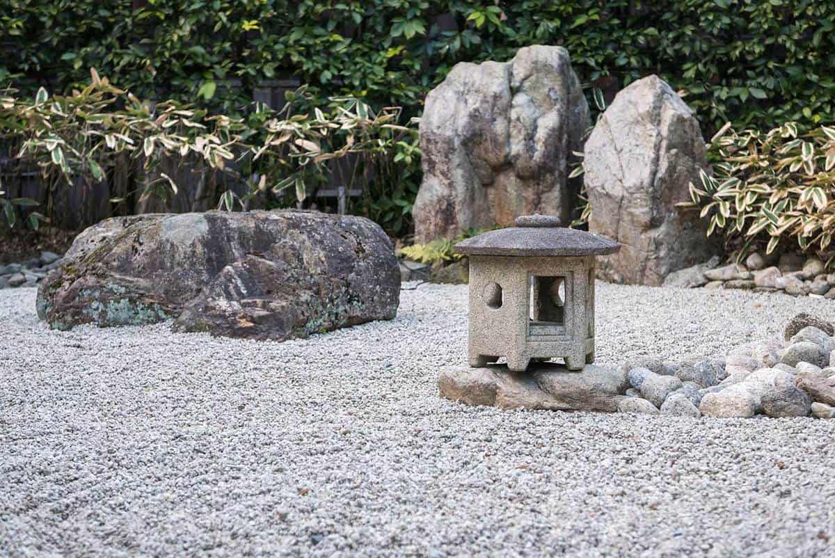 A stone lantern in traditional zen garden of a buddhist temple