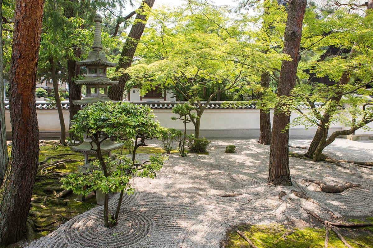 Zen rock garden at temple in japan with stone lantern