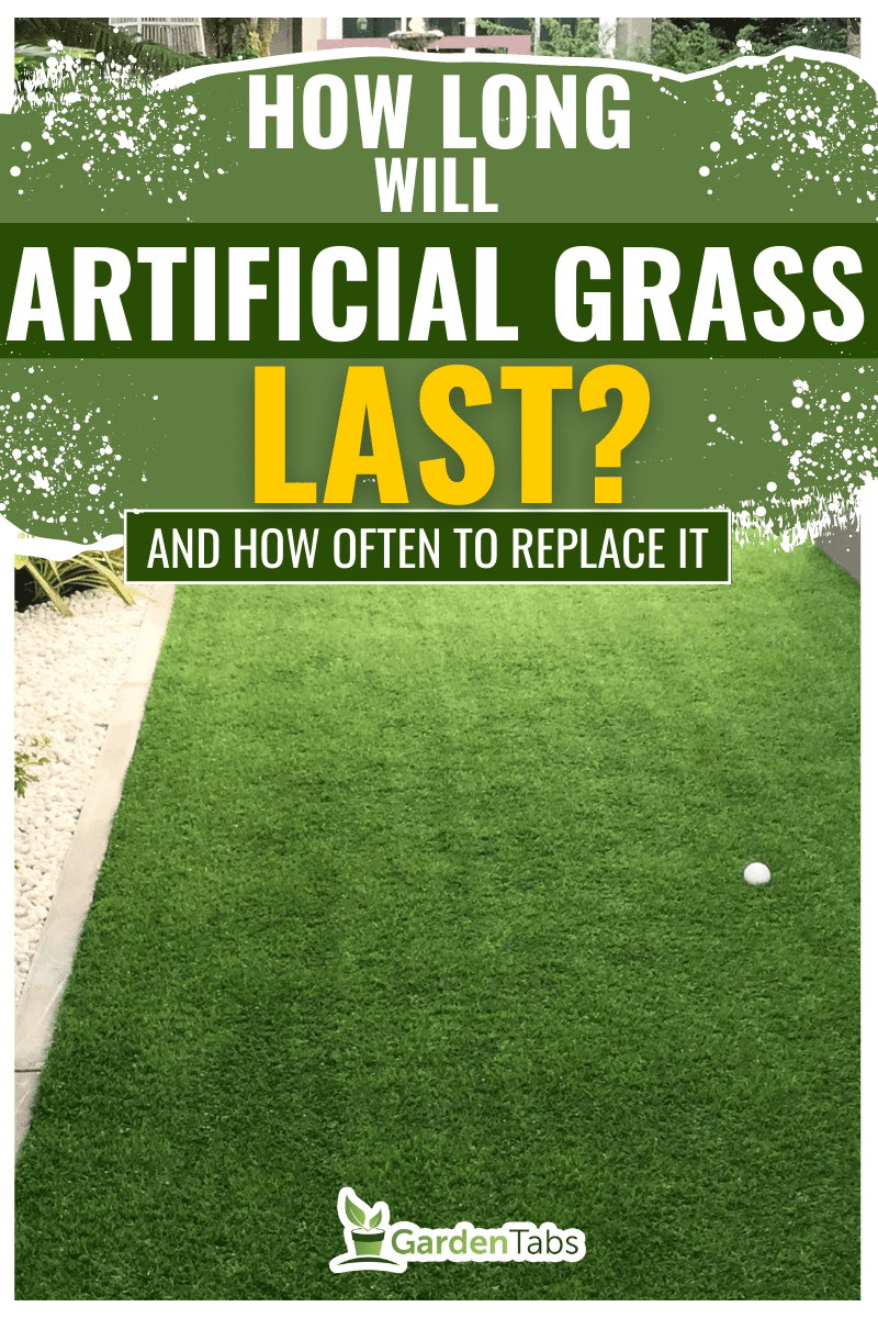 Artificial grass background. Tender hand of a baby on a green artificial turf floor. - How Long Will Artificial Grass Last? [And How Often To Replace It] 