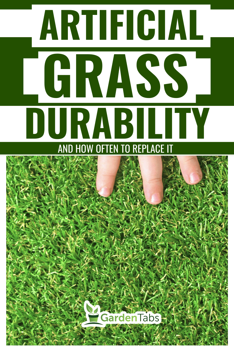 Roll of astroturf or field turf matting of artificial grass soccer field,green lawn background with workers pave the counterfeit grass.
