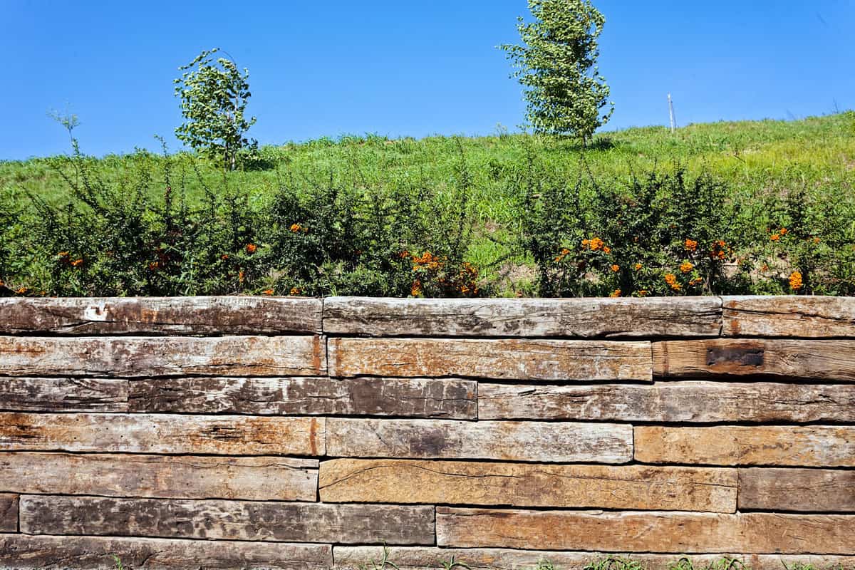 A retaining wall made out of decorative rocks, How To Build A Retaining Wall On A Slope