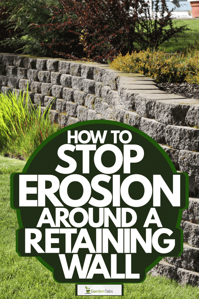 A retaining wall decorated with decorative rocks on the backyard garden, How To Stop Erosion Around A Retaining Wall