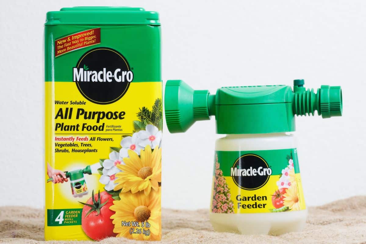 container of Miracle - Gro All Purpose Plant Food, which contains four Garden Feeder Refill Packets, along with the Miracle - Gro Garden Feeder. Scotts Miracle - Gro Products, Inc.