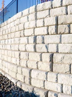 Corner view of a precast cement block retaining wall, Can You Build A Retaining Wall On Your Property Line?