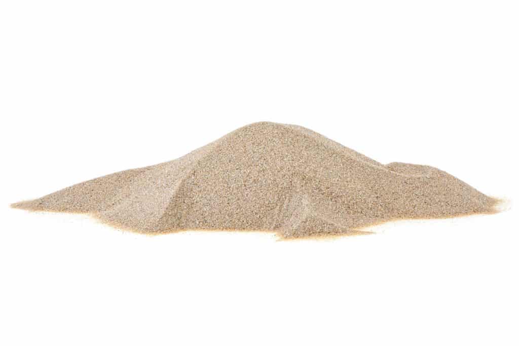 A pile of sand in a white background