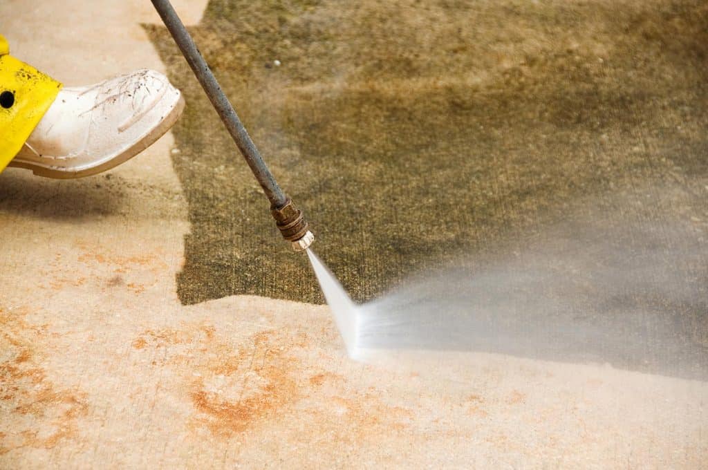 Pressure washing concrete floor