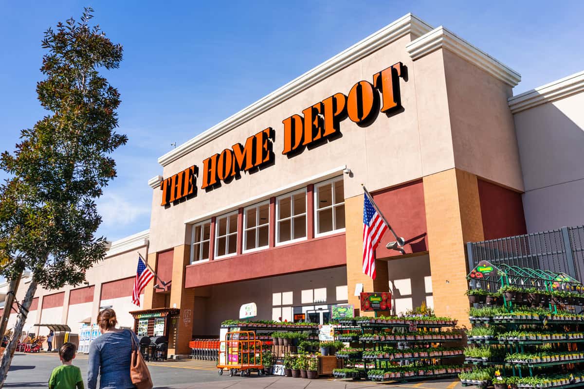 A home depot store with the American flag hanged right up front