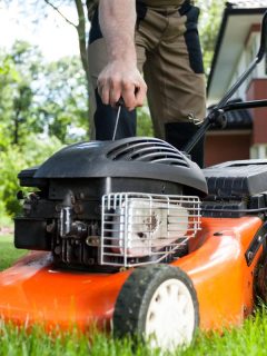 Man turning on the lawn mower by gardener, Why Are Lawn Mowers So Loud?