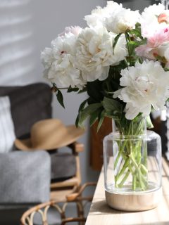 Bouquet of beautiful peony flowers on window sill indoors, Can Peonies Grow In Shade? [How Much Sun Do They Need?]