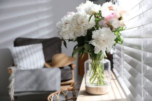 Bouquet of beautiful peony flowers on window sill indoors, Can Peonies Grow In Shade? [How Much Sun Do They Need?]