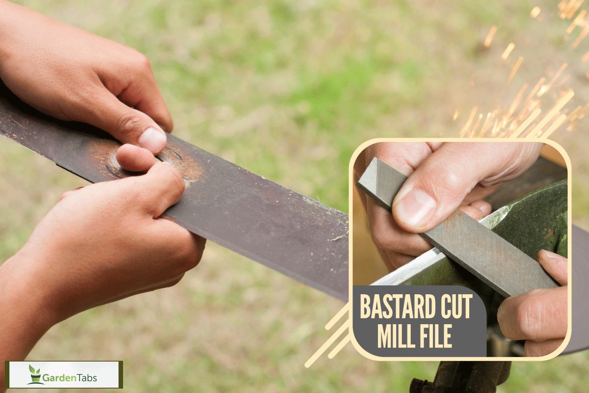 Sharpening Lawn mower blade by holding it by two hands in outdoor, What's The Best File For Sharpening Lawn Mower Blades?
