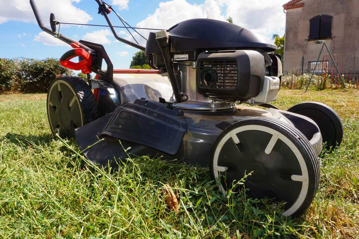 A Honda lawn mower left in the garden