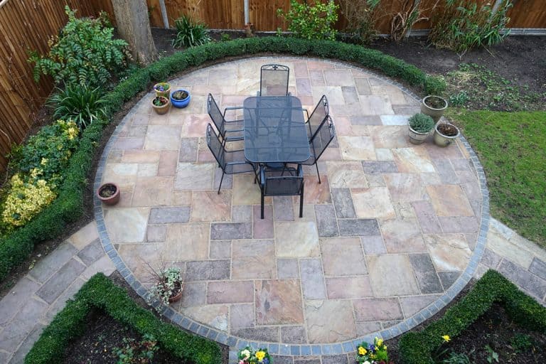 Circular Garden patio with table and chairs, Water Pooling On Patio Pavers - What To Do?