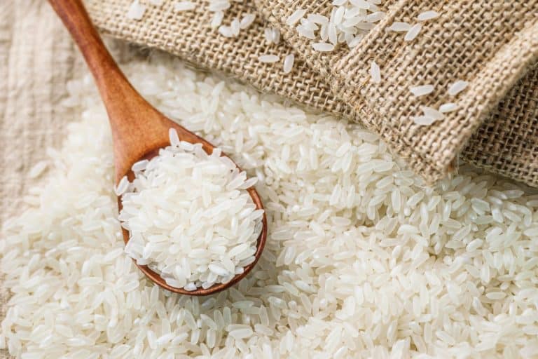 rice on a wooden spoon, display on market, rice grains, Can You Grow Rice From Store Bought Rice?
