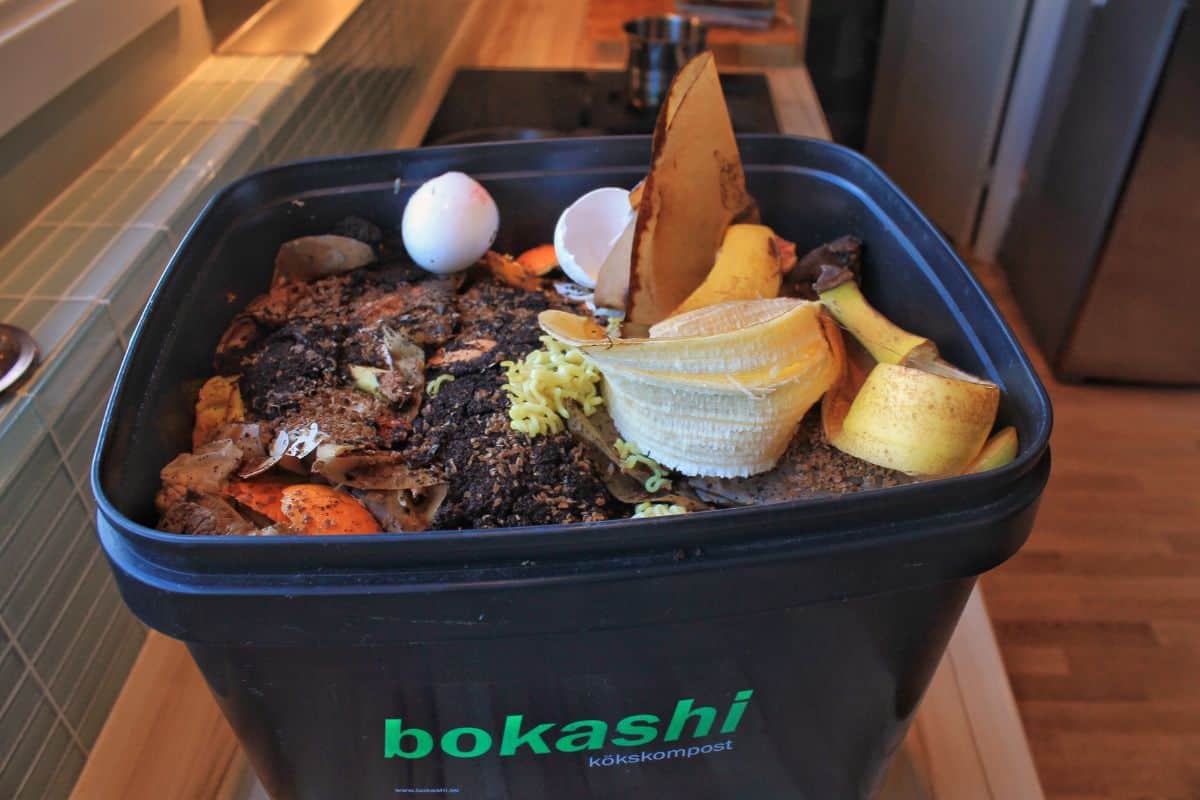 A bucket filled with bokashi. This photo is taken under the process of collecting food waste in the kitchen. Bokashi is a type of fermented wastemanagement.