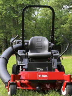 A red colored Toro Lawn mower left in a field, Toro Lawn Mower Bag Not Filling - What's Wrong?