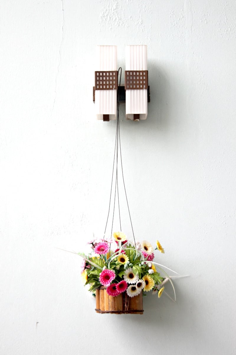 Colorful flowers in wooden basket and was hanging out. Hanging Basket Ideas