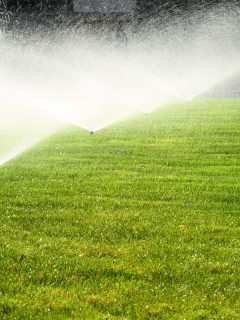 Garden sprinkler on the green lawn, How Far Apart Should Sprinkler Heads Be?