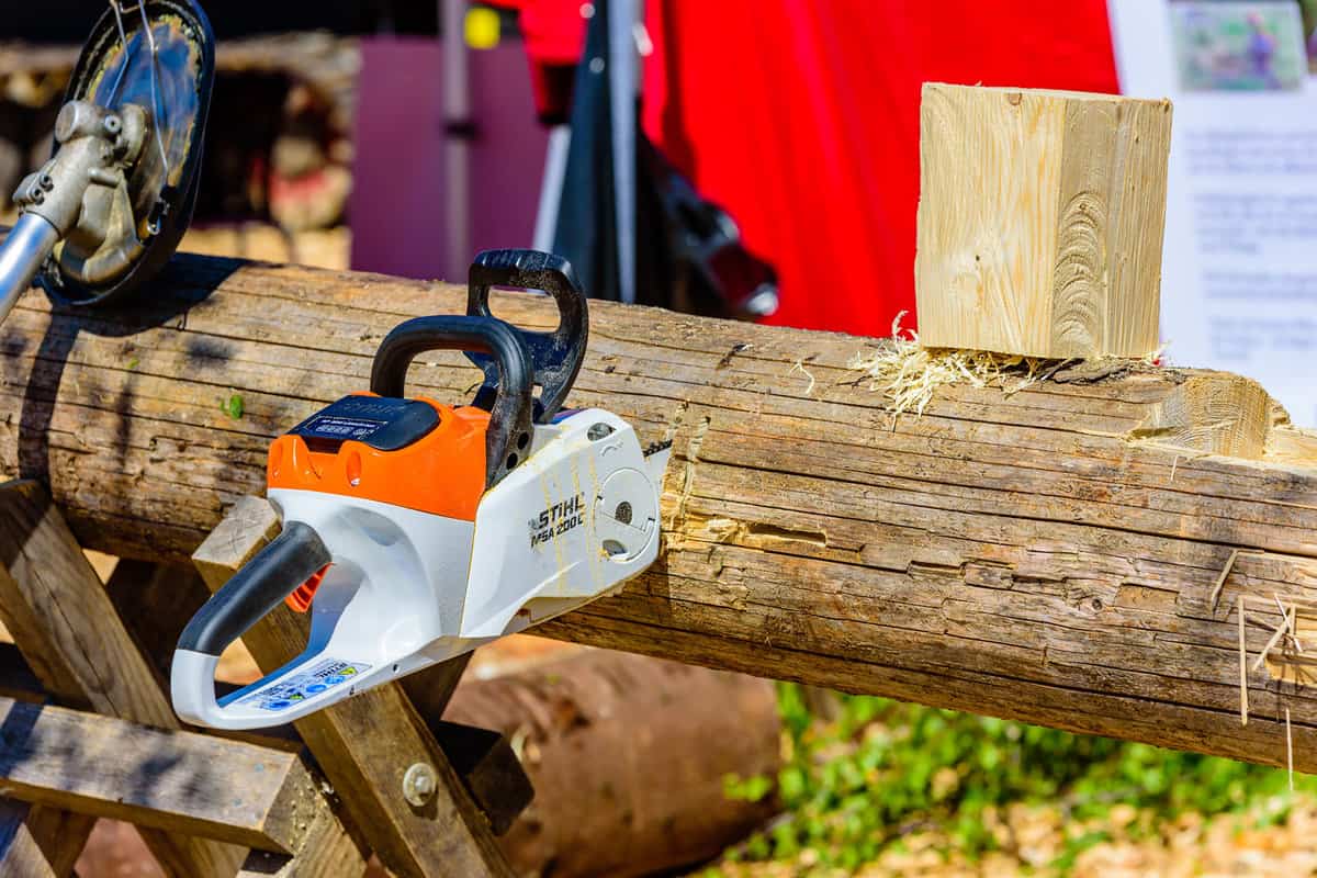 Forest and tractor (Skog och traktor) fair. Stihl MSA 200c battery powered electrical chainsaw in a wooden log