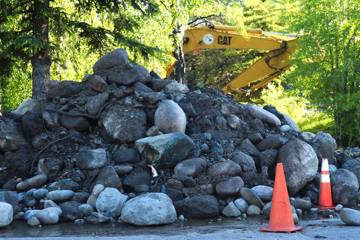 Pile of Rock and Mud Debris from a Submerged Rock Dam Installed in 2018 Removed from Fish Creek