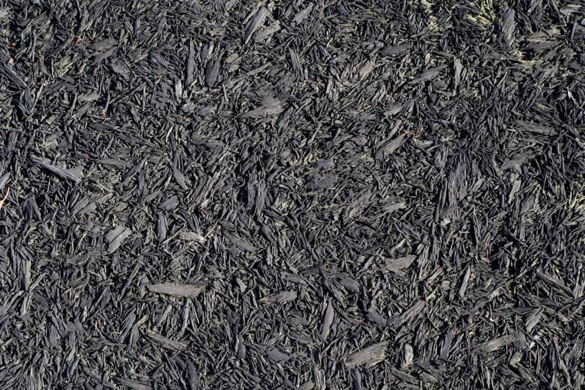 Soft dark rubber bark playground mulch texture floor