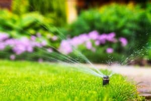 automatic sprinkler system watering the lawn. - Toro Sprinkler Head Doesn't Rotate - Why And How To Fix?