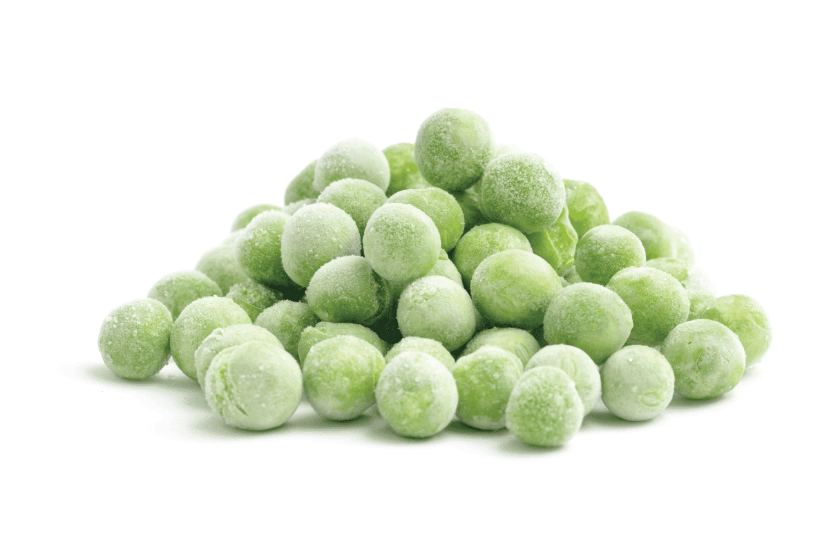 A heap of frozen peas isolated on white.