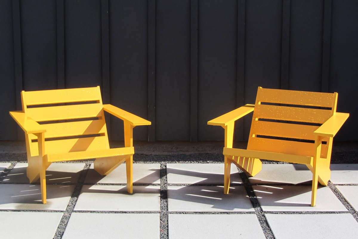 Bright Wooden Chairs on Large Stone Pavers, Ultra Modern or Mid Century Modern