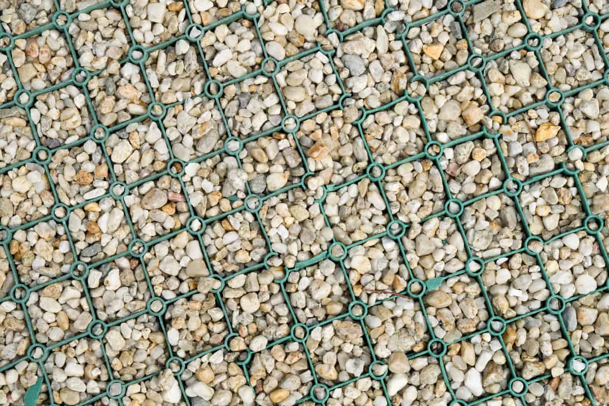 Green plastic grid with gravel in the parking lot