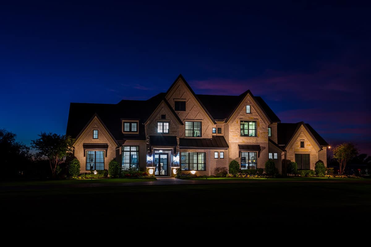 Luxury grand homes illuminated at night