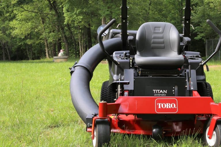 Toro Titan lawn mower in the yard, Toro Lawn Mower Smoking - Why And What To Do?