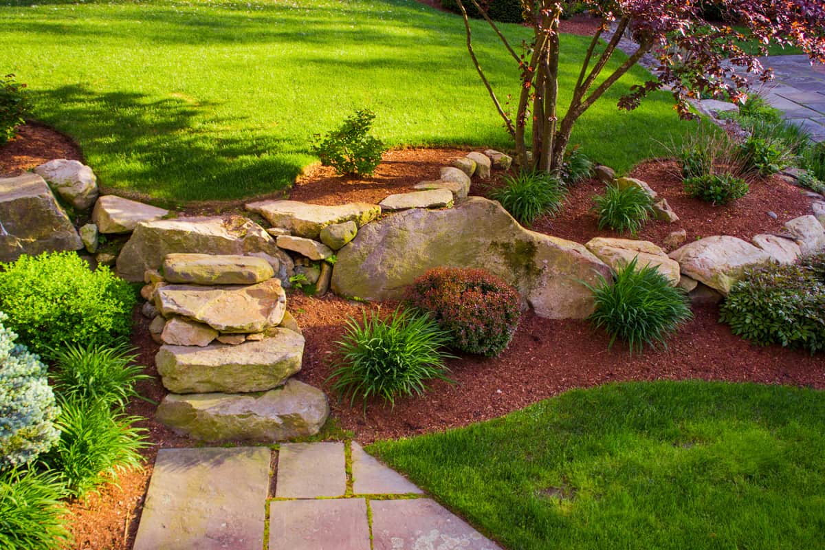 Well landscaped rock stairs and rock wall