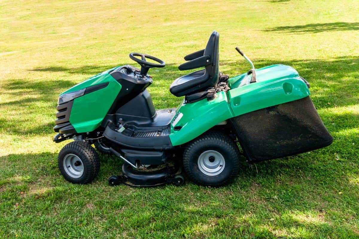 lawn mower on the green lawn