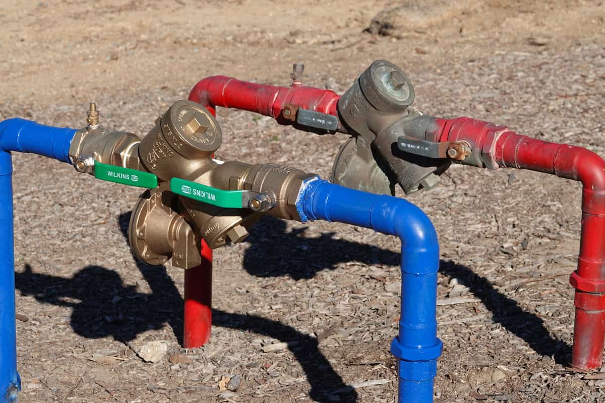 valves with backflow preventer on red and blue water lines