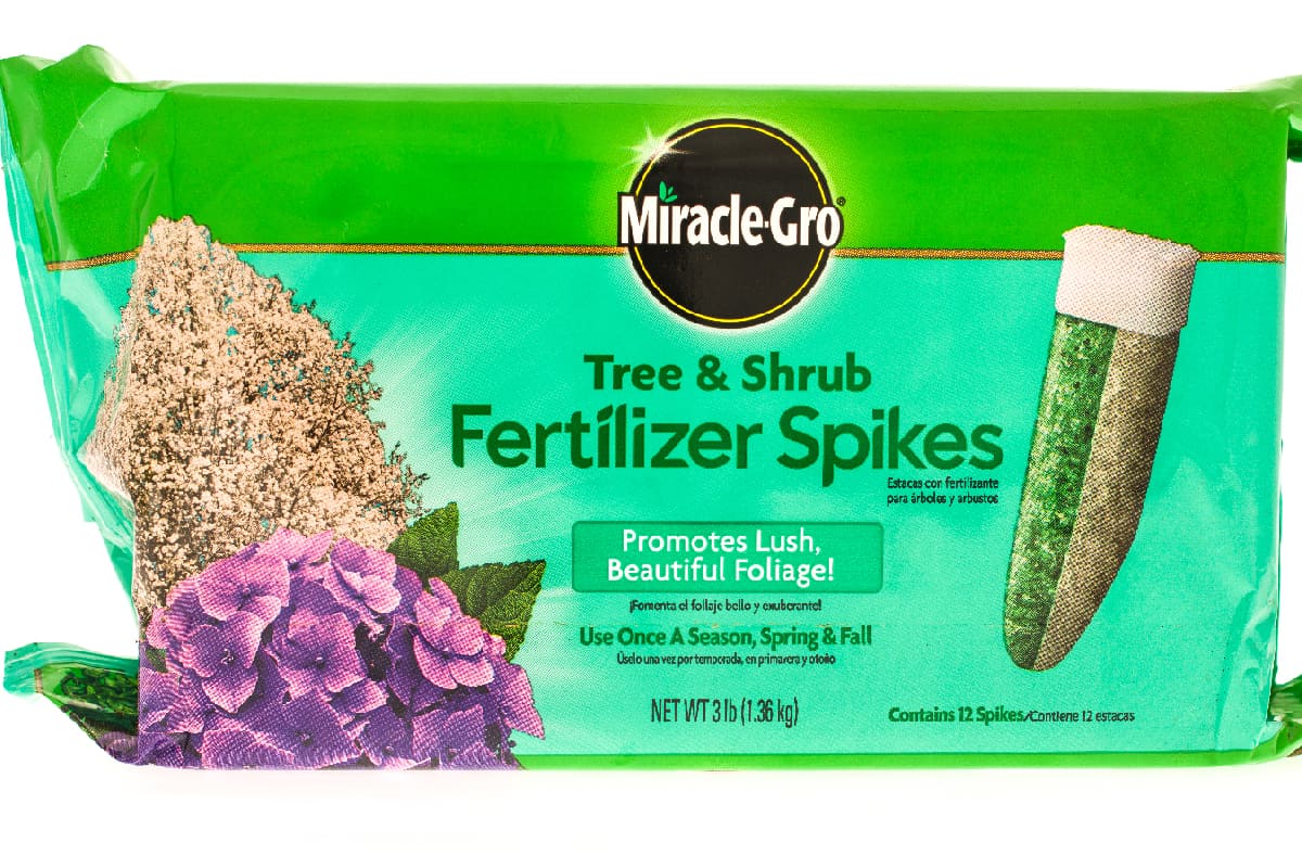 A package of Miracle-Gro tree & shrub fertilizer spikes
