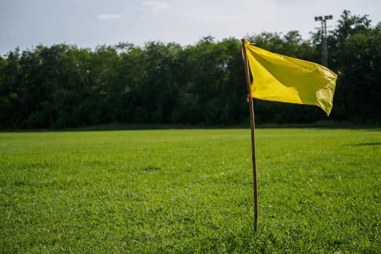 Yellow flag at corner of soccer field. sport flag and sign concept., Yellow Flags In Yard: What Do They Mean? [Here's What You Should Know!]