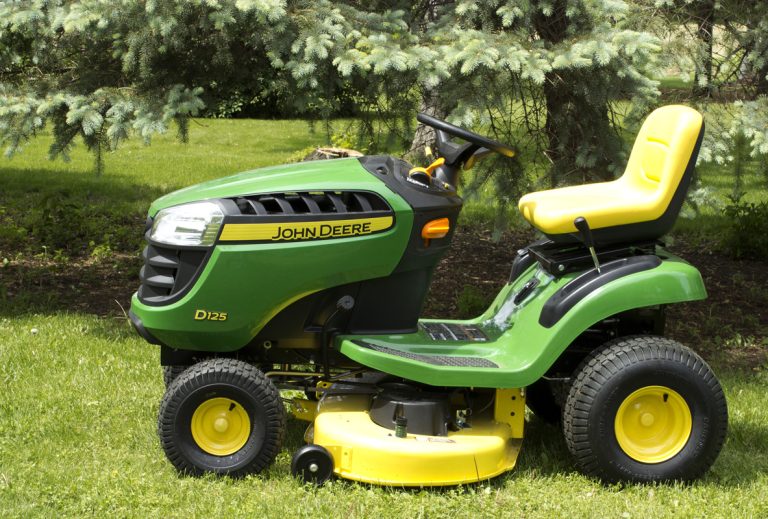 A John Deere lawn tractor in River Falls,Wisconsin on June 02,2015. Deere and Company is Headquartered in Moline,Illinois., My John Deere Mower Makes A Loud Noise When Turning - Why? What To Do?