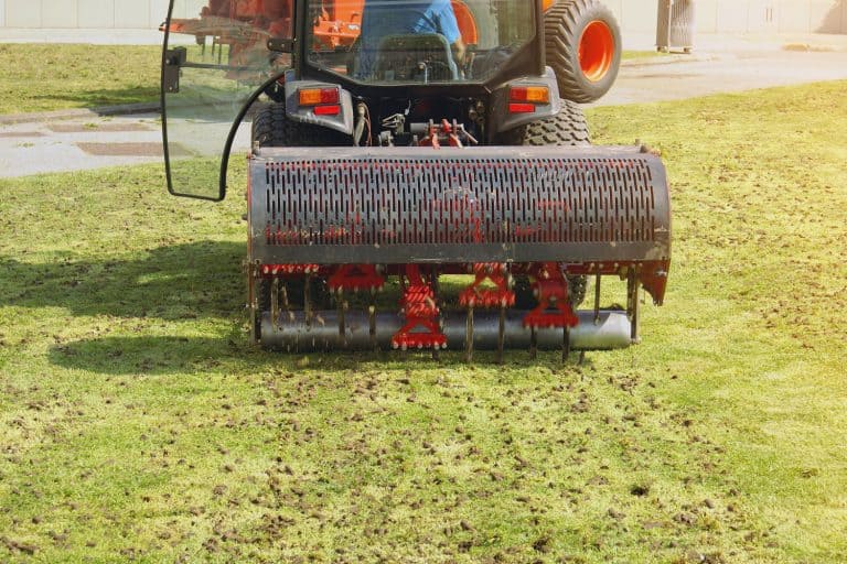 Gardener Operating Soil Aeration Machine on Grass Lawn, How Deep Does An Aerator Go