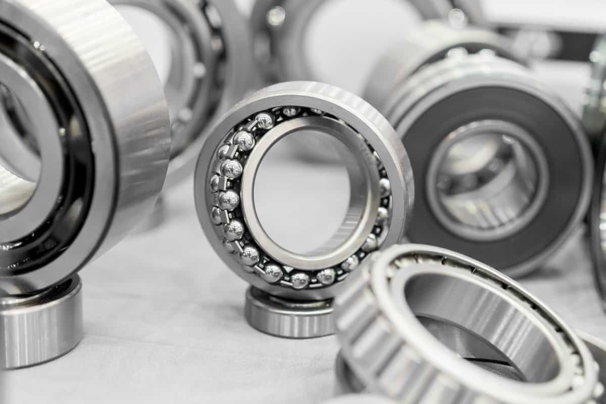 High precision machine parts bearing isolate on white background in workshop 