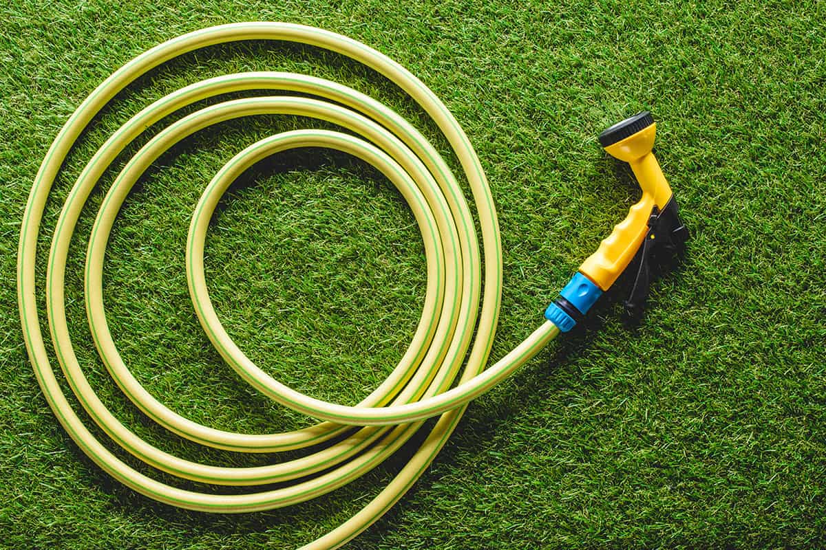 Top view of hosepipe on grass