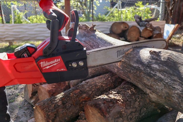 sing my Milwaukee Fuel battery powered chainsaw to cut fire wood, How To Remove The Battery From A Milwaukee Pruning Saw [Step By Step Guide]