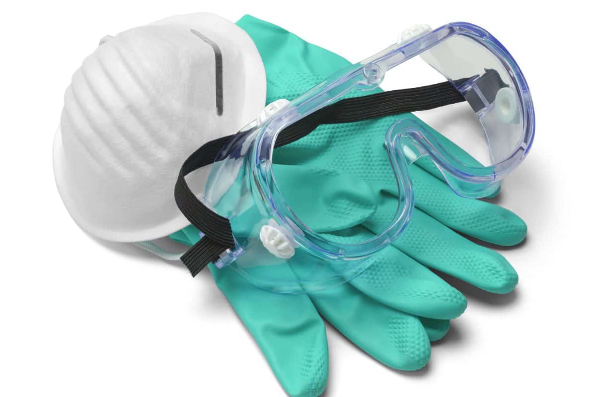 Mask, Gloves and Goggles in Pile Isolated on White Background.