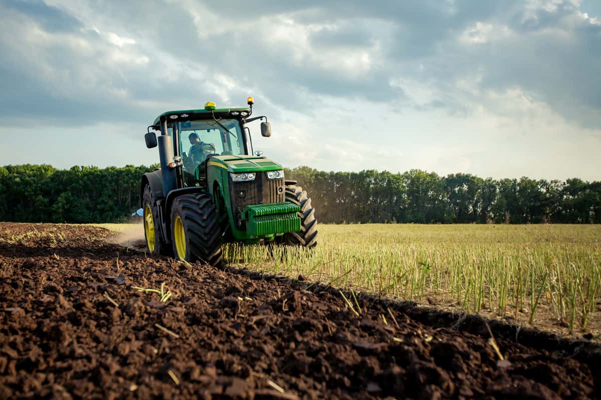 Ploughing a field with John Deere tractor