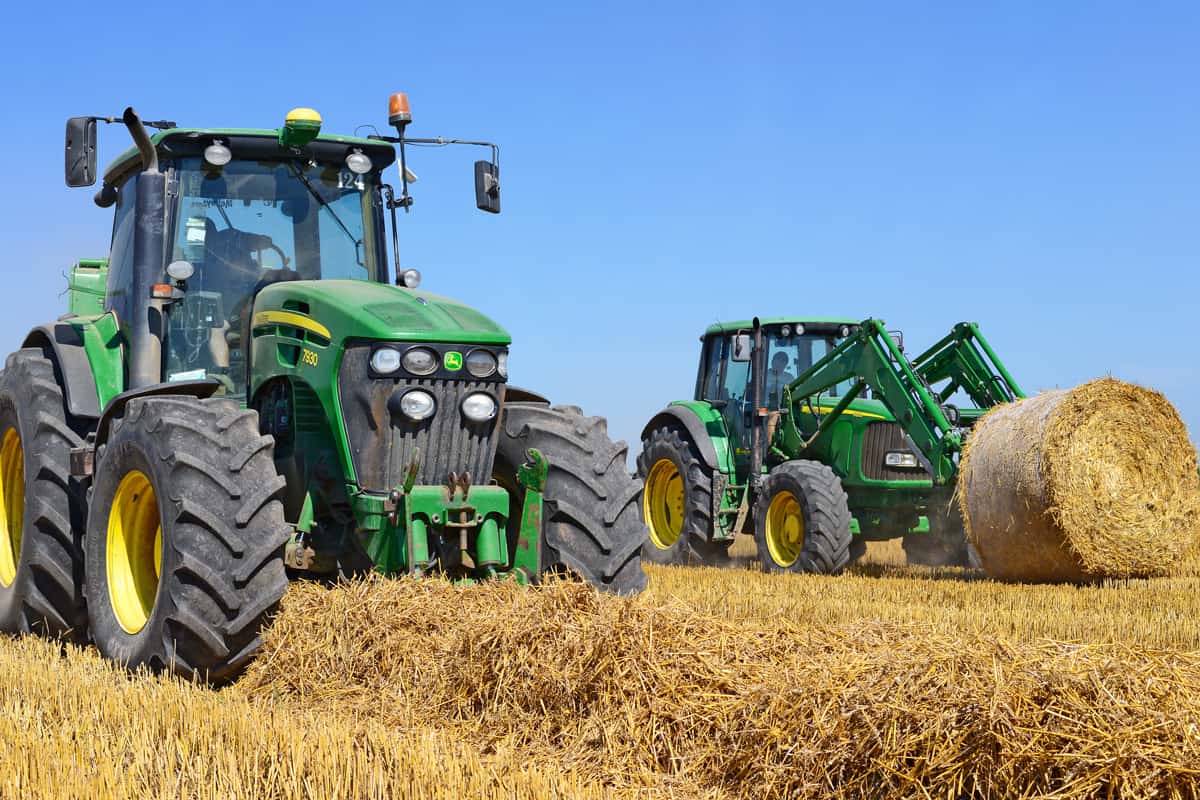 Universal tractor harvesting straw in the field