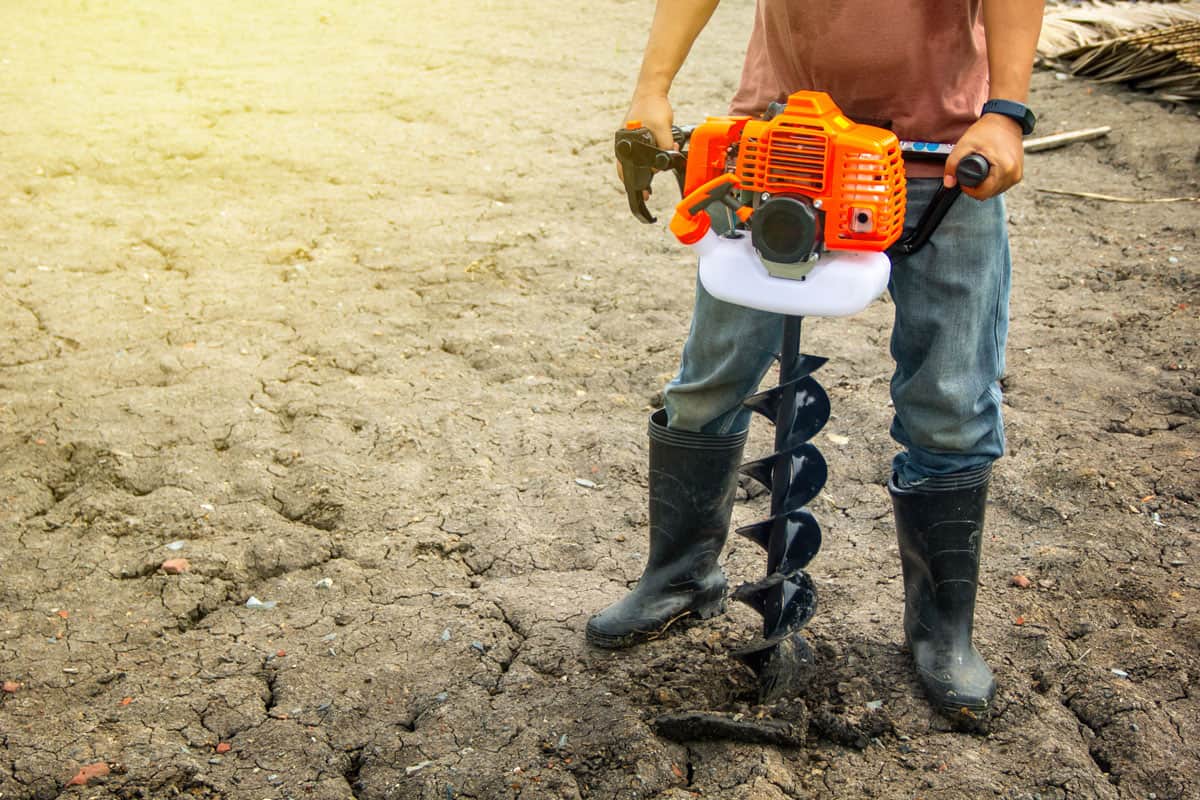 farmer using tools handheld soil hole