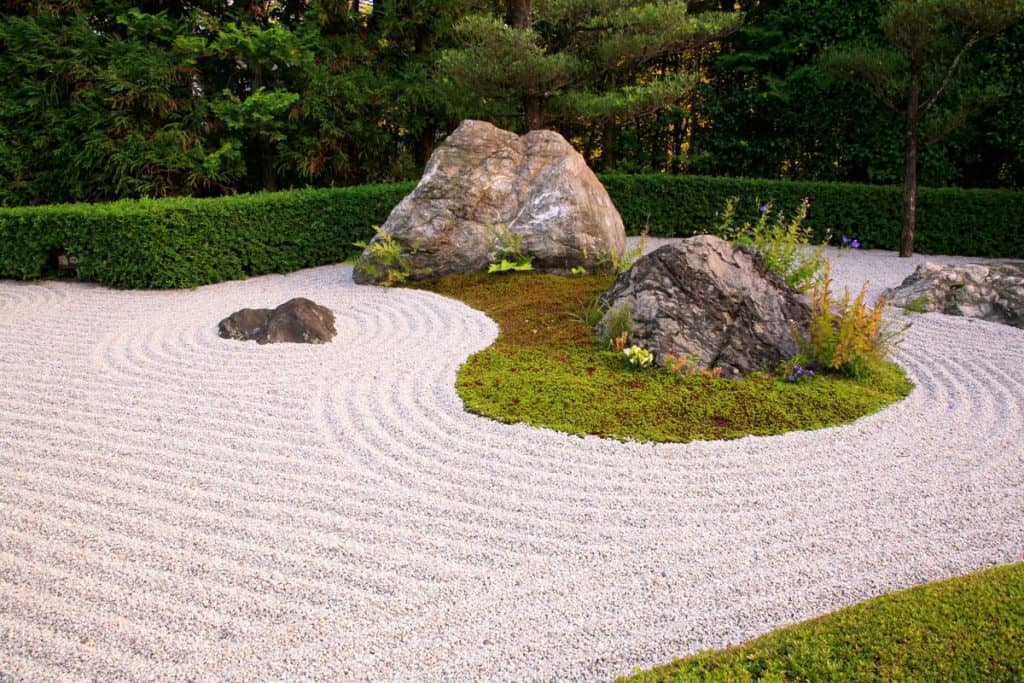 Landscape stone garden (karesansui), containing several angular rocks and smaller stones resembling the cliffs of the island of Horai, with a streamock. Garden located in Taizo-in temple. Kyoto, Japan