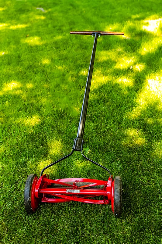 Refinished manually powered lawn mover