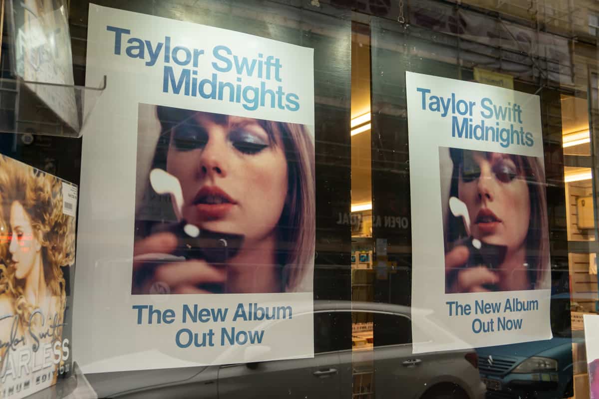 Publicity materials for Taylor Swift's album Midnights on display in a record shop window