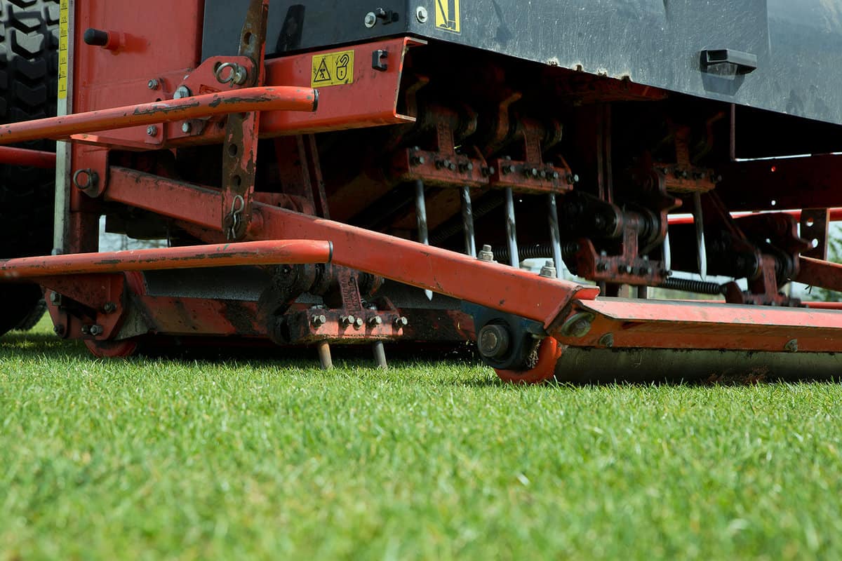 Tractor aerating a football field